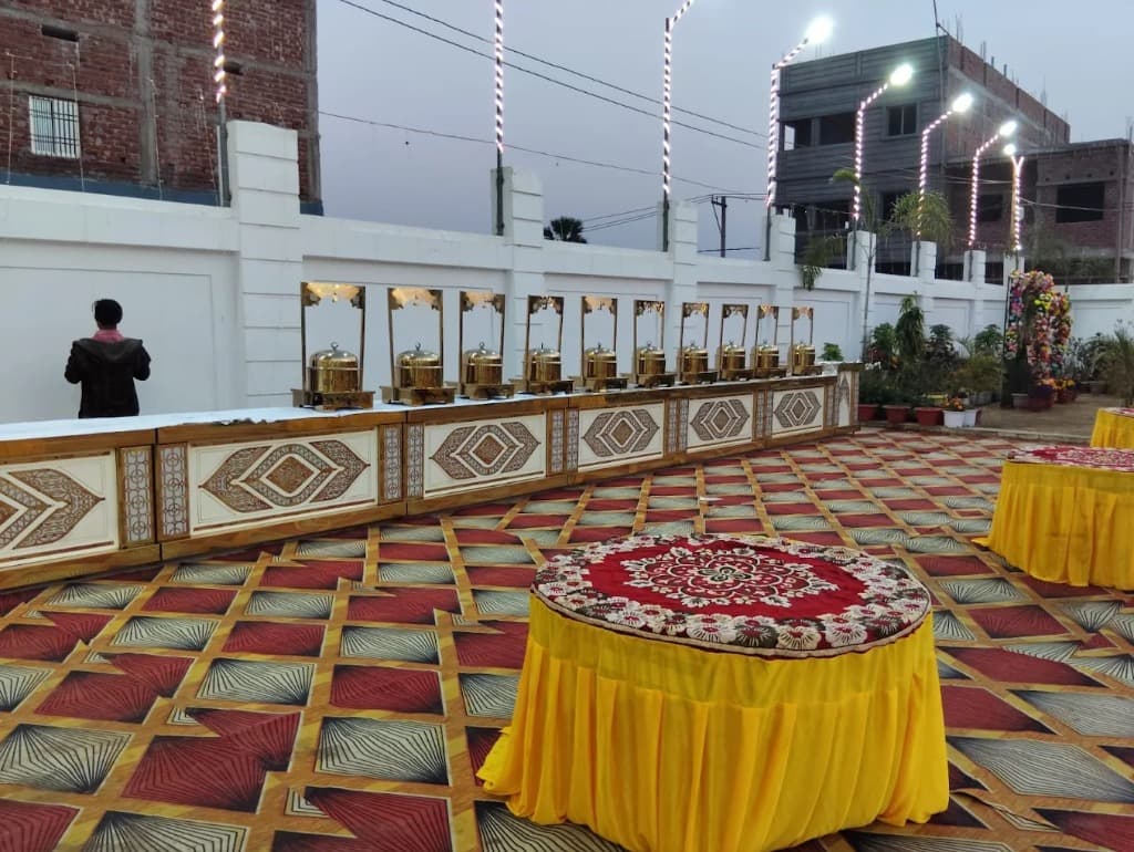 Milan Palace outdoor catering buffet setup with gold chafing dishes
