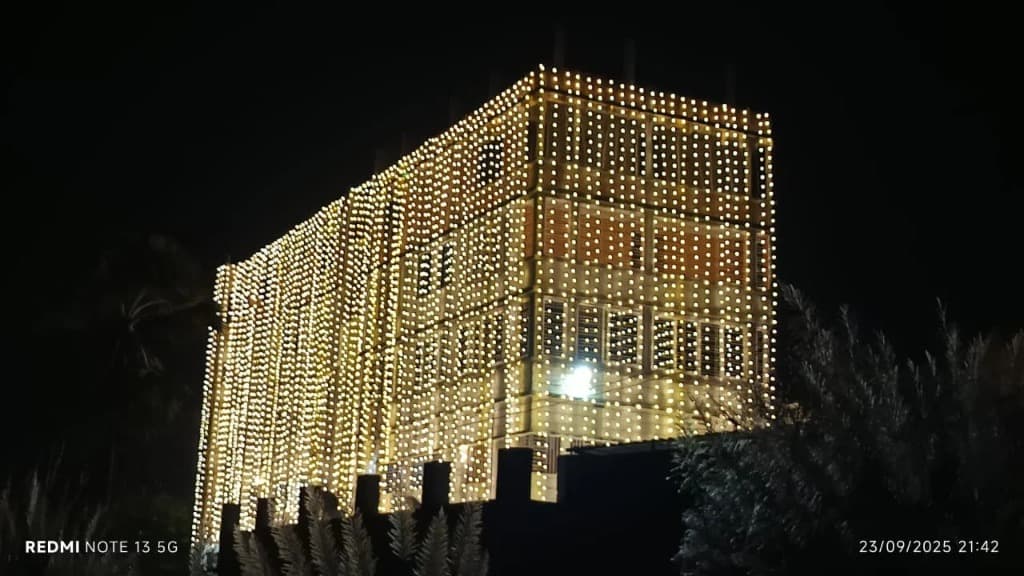 Milan Palace building draped in golden fairy lights for a wedding celebration